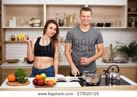 Health-conscious Lifestyle, Proper Nutrition, Diet.  Fit Sporty People Cooking Low Calorie Food At H