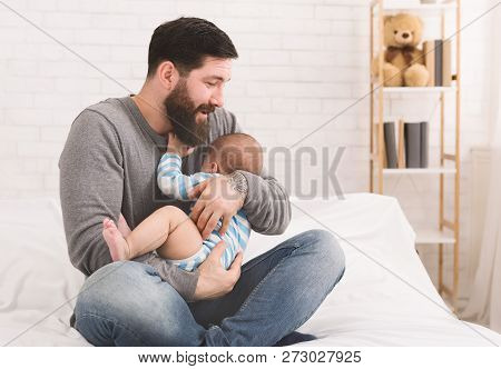 Young Father Soothing His Hungry Crying Baby Son, Copy Space