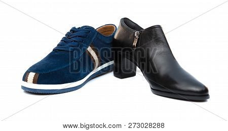 Blue Shoe For Husband And Black One For Wife On White As Filiation Concept