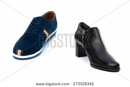 Blue Shoe For Husband And Black One For Wife On White As Filiation Concept