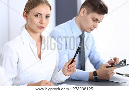 Group Of Business People Or Lawyers Discussing  Terms Of Transaction In Office. Colleagues Working A