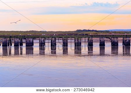 Purple Sunset At The Junction Of River Blyth And Dunwich River In Southwold, A Popular Seaside Town 