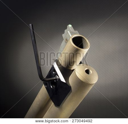 Wrench Tightening A Base For A Weaponlight On A Shotgun