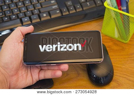 Piatra Neamt, Romania - July 30, 2018: Hand Holds A Samsung S8+ With Verizon Logo On The Screen, Off