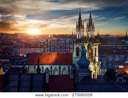 Illuminated Tynsky Temple In Prague At Sunset