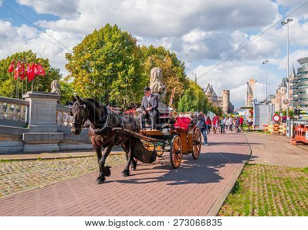 Traditional Horse Cart Enjoyed By Tourist At Market Square In Antwerp