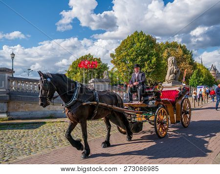 Traditional Horse Cart Enjoyed By Tourist At Market Square In Antwerp