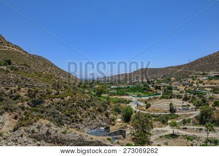 Overflow Area Below Germasogeia Dam, Showing The Hilly Countryside And Looking To The Sea In The Bac