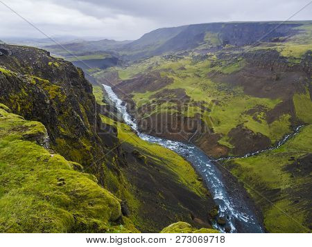 Landscape Valley Of River Fossa With Blue Water Stream And Green Hills And Moss Covered Cliffs, In S