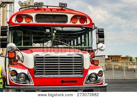 Guatemala, Puerto, Quetzal - 2018.
Local Bus, Vintage Red Bus. Old School Bus.