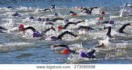 St Neots, Cambridgeshire, England - July 01, 2018:  Triathlon Swimmers In The River Ouse At St Neots