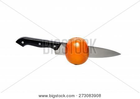 Persimmon Wirh Knife Inside, Cut In Half. Isolated On A White Background, With Clipping Path
