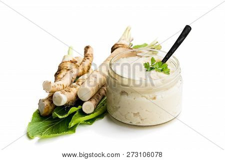 Spicy  Horseradish Sauce In Glass Jar Isolated On White