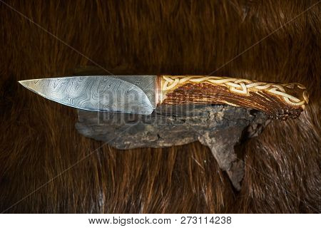 Hunting Knife With A Wooden Handle With Lambskin