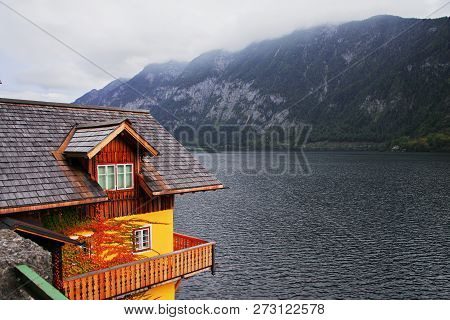 Scenic View Of Famous Hallstatt Mountain Village With Hallstatter Lake. Sunny Autumn Sunrise On Hall