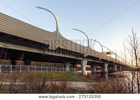Flyover Of The Highway Over River At Sunset