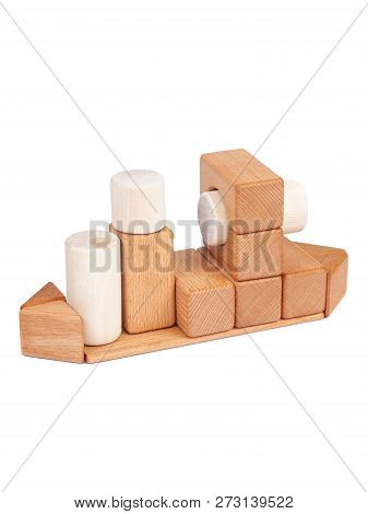 Photo Wooden Constructor Of Small Cubes, Triangles, Balls And Other Forms Of Beech On A White Isolat