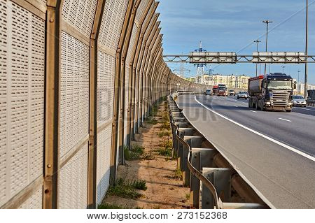 St. Petersburg, Russia - August 28, 2018: Lorry Drives Along The Freeway With Highway Sound Proof Ba