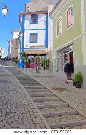 Monchique, Portugal - November 13, 2018: Steep Cobbled Street (porto Fundo) With Colorful Buildings 