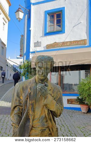 Monchique, Portugal - November 13, 2018: Close-up On A Bronze Statue Representing A Man Standing On 