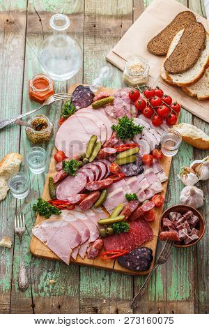 Charcuterie Board With Sausages And Smoked Meat. Top View.
