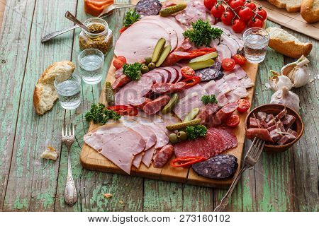 Charcuterie Board With Sausages And Smoked Meat. Top View.