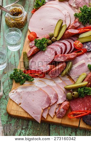 Charcuterie Board With Sausages And Smoked Meat. Top View.