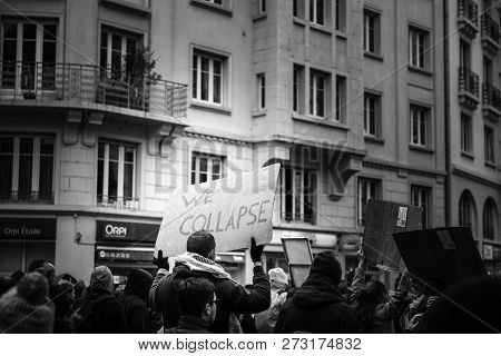 Strasbourg, France - Dec 8, 2018: We Collapse Message On Placard As Crowd Marching In Central Strasb