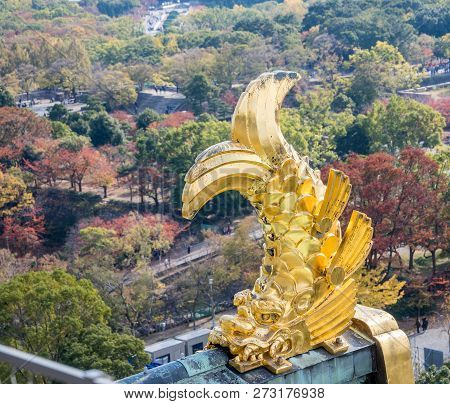 Osaka, Japan, November 25, 2018: Shachihoko (shachi) At World Famous Osaka Castle Roof In Autumn Wit