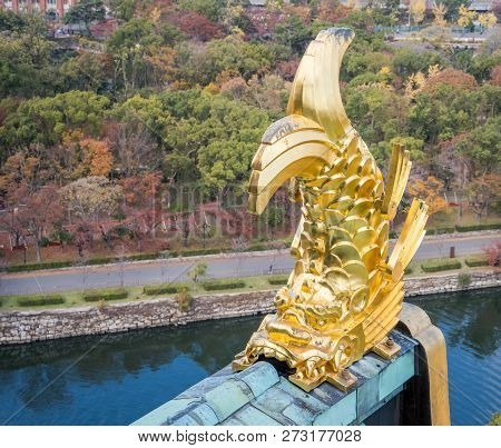 Osaka, Japan, November 25, 2018: Shachihoko (shachi) At World Famous Osaka Castle Roof In Autumn Wit