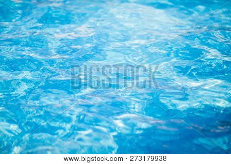 Clear Blue Water With Waves In The Swimming Pool, Background.