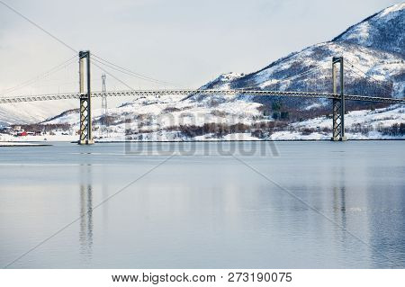 The Tjeldsund Suspension Road Bridge In Winter Crossing The Tjeldsundet Strait, Troms County, Norway