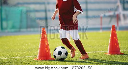 Youth Soccer Practice Drills With Cones. Soccer Drills: Slalom Drill. Young Football Players Trainin