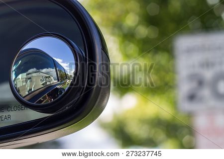 Close Up Of A Blind Spot Mirror On The Passenger Side