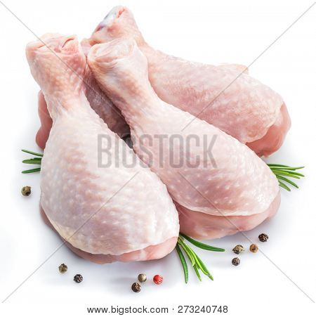 Chicken legs with spices isolated on white background.