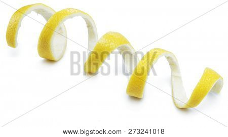 Lemon peel or lemon twist on white background. Close-up.