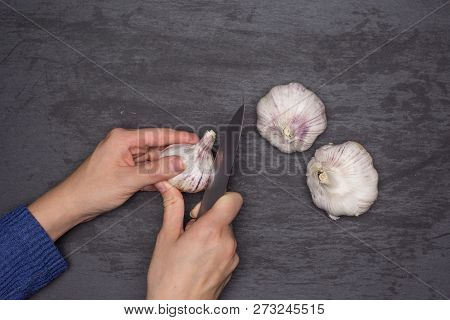 Woman Hands Are Spliting Garlic Cloves. Recipe Step By Step Baked Potatoes With Onion Flatlay On Gre