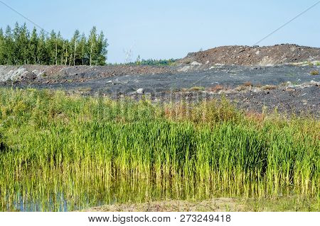 Desert Landscape After Mining Activities. The Destruction Of Forests Due To The Overburden Dump Pit.