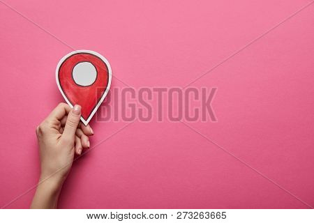 Top View Of Red Geolocation In Hand On Pink Background