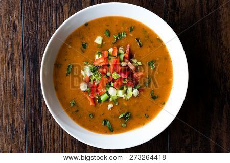 Traditional Konya Bulgur Soup Batirik With Sliced Cucumber, Tomatoes, Onion And Parsley