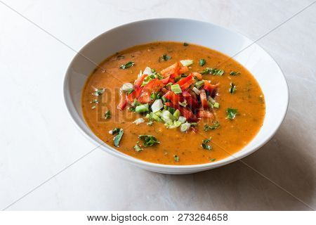 Traditional Konya Bulgur Soup Batirik With Sliced Cucumber, Tomatoes, Onion And Parsley