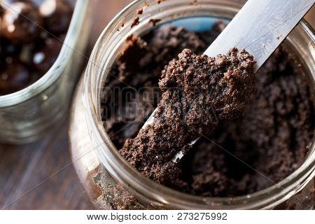 Black Olive Tapenade With Knife In Jar