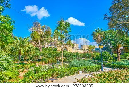Naxxar, Malta - June 14, 2018: The Alleys In Garden Of Palazzo Parisio, Surrounded With Lush Greener