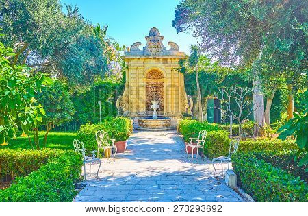 Naxxar, Malta - June 14, 2018: The Beautiful Fountain In Antique Style With Amphora In Park Of Palaz