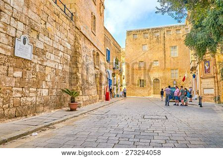 Mdina, Malta - June 14, 2018: The Mdina Rd. Square With Its Huge Medieval Edifices Located Right Aft
