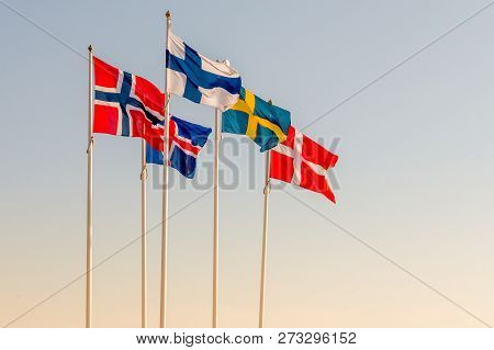 Danish, Swedish, Icelandic, Finnish And Norwegian Scandinavian Flags Waving On The Wind In Helsinbor