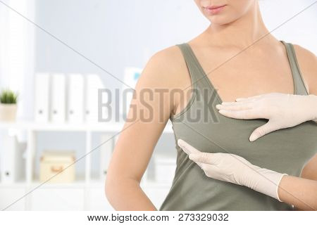 Doctor Checking Woman's Breast At Hospital, Closeup. Space For Text