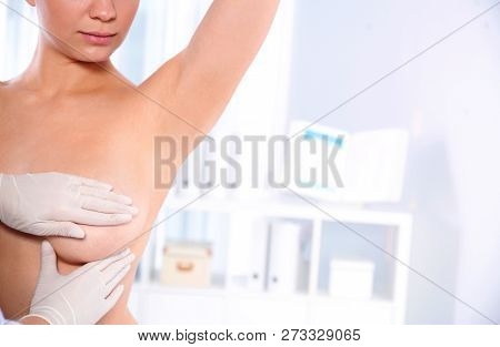 Doctor Checking Woman's Breast At Hospital, Closeup. Space For Text