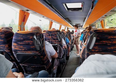 Marmaris, Turkey - May 26, 2018: Female Guide In The Bus With Tourists. People During Travel. Transf