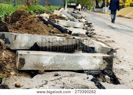 Broken Freshly Dug Up Old Curbstones With Pieces Of An Asphalt And Earth Lying On The Road In Moscow